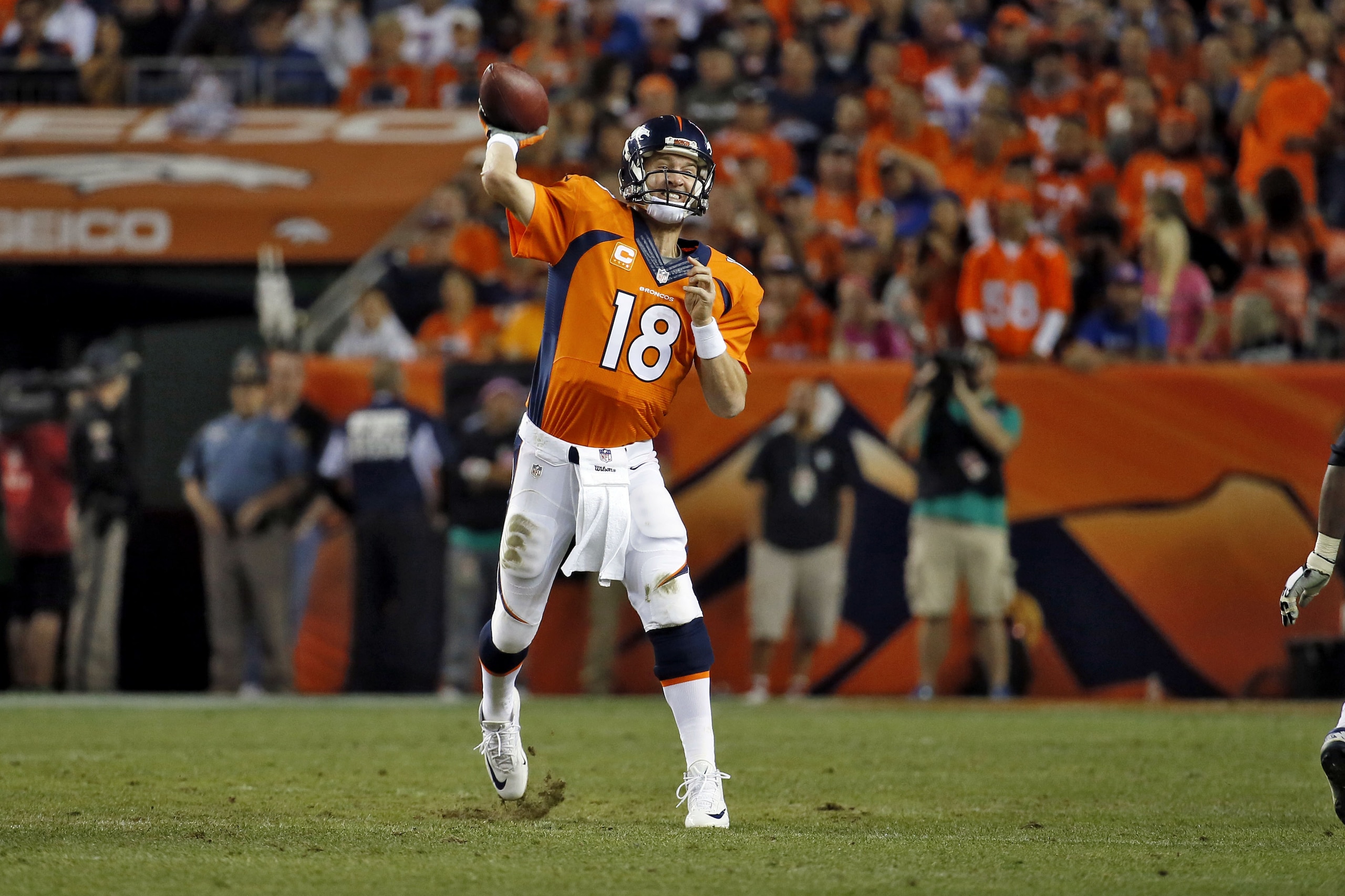 Denver Broncos quarterback Peyton Manning (18) throws against the San Diego Chargers during the second half of an NFL football game, Thursday, Oct. 23, 2014, in Denver. (AP Photo/Jack Dempsey)