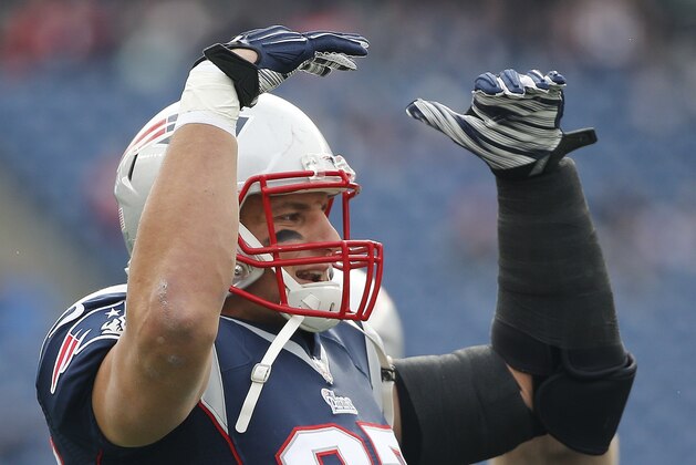 New England Patriots tight end Rob Gronkowski warms up before an NFL football game against the Chicago Bears on Sunday, Oct. 26, 2014, in Foxborough, Mass. (AP Photo/Elise Amendola)