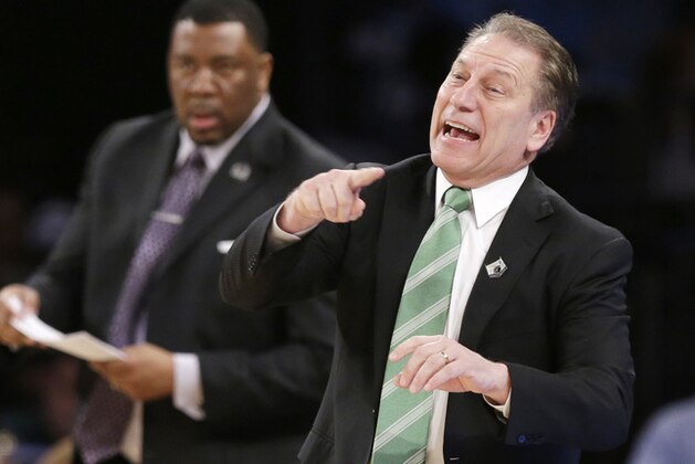 Michigan State head coach Tom Izzo instructs his team in the first half of a regional final against Connecticut at the NCAA college basketball tournament on Sunday, March 30, 2014, in New York. (AP Photo/Frank Franklin II)