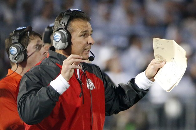 Ohio State coach Urban Meyer reacts to an Ohio State touchdown during the second quarter an NCAA college football game against Penn State in State College, Pa., Saturday, Oct. 25, 2014. (AP Photo/Gene J. Puskar)