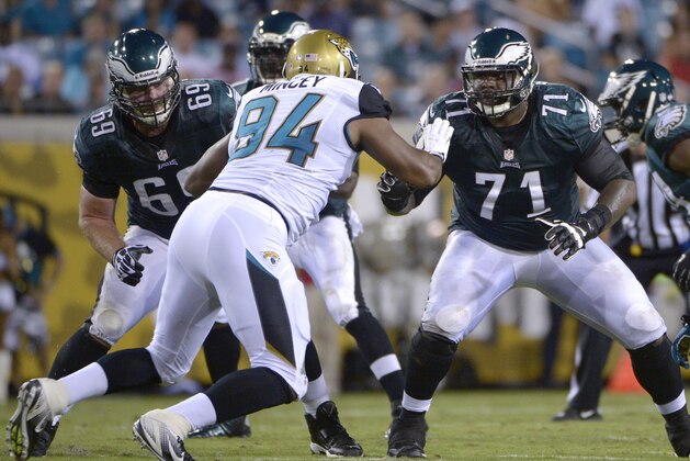 ADVANCE FOR WEEKEND EDITIONS OF DEC. 14-15 - FILE - In an Aug. 24, 2013, file photo Philadelphia Eagles guard Evan Mathis (69) and tackle Jason Peters (71) block against Jacksonville Jaguars defensive end Jeremy Mincey (94) during the first half of an NFL preseason football game in Jacksonville, Fla. Jason Peters, Evan Mathis, Jason Kelce, Todd Herremans and Lane Johnson don't get much recognition, but coaches and teammates credit the big guys upfront for helping the offense lead the NFL in rushing. (AP Photo/Phelan M. Ebenhack, File) ADVANCE FOR WEEKEND EDITIONS OF DEC. 14-15 - FILE - In an Aug. 24, 2013, file photo Philadelphia Eagles guard Evan Mathis (69) and tackle Jason Peters (71) block against Jacksonville Jaguars defensive end Jeremy Mincey (94) during the first half of an NFL preseason football game in Jacksonville, Fla. Jason Peters, Evan Mathis, Jason Kelce, Todd Herremans and Lane Johnson don't get much recognition, but coaches and teammates credit the big guys upfront for helping the offense lead the NFL in rushing. (AP Photo/Phelan M. Ebenhack, File)