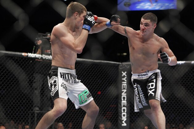 John Hathaway trades punches with Diego Sanchez during their UFC welterweight mixed martial art match Saturday, May 29, 2010 at The MGM Grand Garden Arena in Las Vegas. (AP Photo/Eric Jamison)