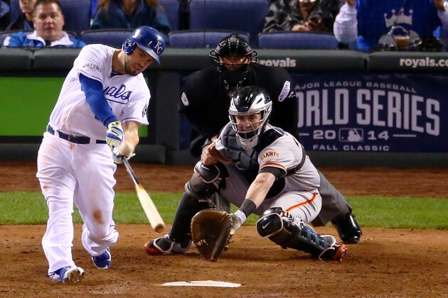 KANSAS CITY, MO - OCTOBER 28:  Mike Moustakas #8 of the Kansas City Royals hits a solo home run in the seventh inning against the San Francisco Giants during Game Six of the 2014 World Series at Kauffman Stadium on October 28, 2014 in Kansas City, Missouri.  (Photo by Dilip Vishwanat/Getty Images)