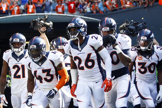 Sep 21, 2014; Seattle, WA, USA; Denver Broncos strong safety T.J. Ward (43), Denver Broncos free safety Rahim Moore (26), Denver Broncos tight end Julius Thomas (80), Denver Broncos strong safety David Bruton (30) and Denver Broncos cornerback Aqib Talib (21) come out of the locker room for pre game warmups against the Seattle Seahawks at CenturyLink Field. Mandatory Credit: Joe Nicholson-USA TODAY Sports