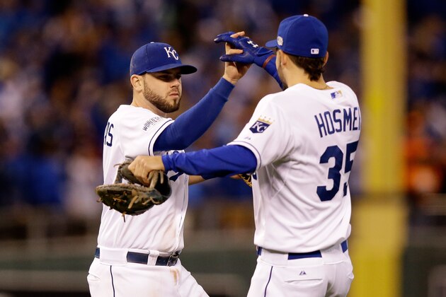 KANSAS CITY, MO - OCTOBER 28:  Mike Moustakas #8 and Eric Hosmer #35 of the Kansas City Royals celebrate after defeating the San Francisco Giants by a score of 10-0 to win Game Six of the 2014 World Series at Kauffman Stadium on October 28, 2014 in Kansas City, Missouri.  (Photo by Ezra Shaw/Getty Images)
