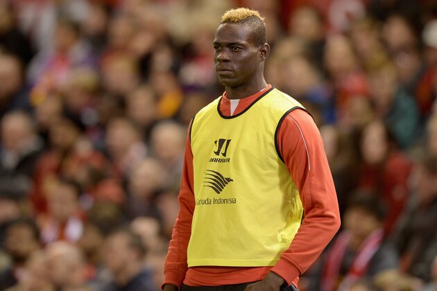 LIVERPOOL, ENGLAND - OCTOBER 28:  Mario Balotelli of Liverpool watches from the sidelines during the Capital One Cup Fourth Round match between Liverpool and Swansea City at Anfield on October 28, 2014 in Liverpool, England.  (Photo by Gareth Copley/Getty Images)