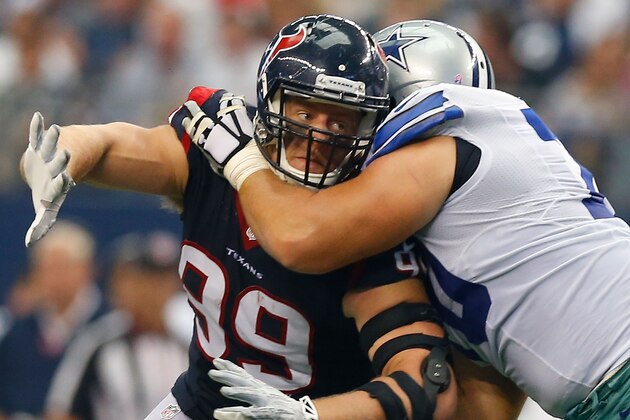 ARLINGTON, TX - OCTOBER 05:  J.J. Watt #99 of the Houston Texans is blocked by Zack Martin #70 of the Dallas Cowboys  in the second half at AT&T Stadium on October 5, 2014 in Arlington, Texas.  (Photo by Tom Pennington/Getty Images)