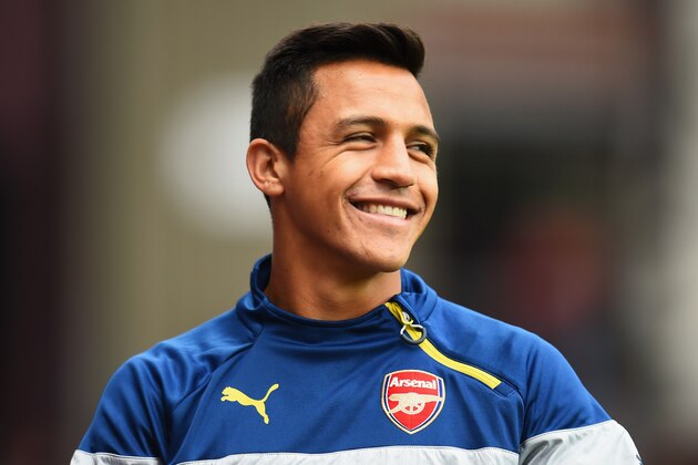 BIRMINGHAM, ENGLAND - SEPTEMBER 20: Alexis Sanchez of Arsenal smiles prior to the Barclays Premier League match between Aston Villa and Arsenal at Villa Park on September 20, 2014 in Birmingham, England.  (Photo by Shaun Botterill/Getty Images)