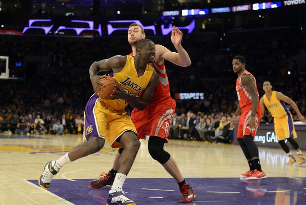 Oct 28, 2014; Los Angeles, CA, USA; Los Angeles Lakers forward Julius Randle (30) drives against Houston Rockets forward Donatas Motiejunas (20) during the second half at Staples Center. Mandatory Credit: Richard Mackson-USA TODAY Sports
