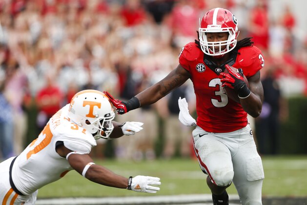 Georgia running back Todd Gurley (3) tries to break free from Tennessee defensive back Brian Randolph (37) in the second half of an NCAA college football game  Saturday, Sept. 27, 2014, in Athens, Ga. Georgia won 35-32. (AP Photo/John Bazemore)