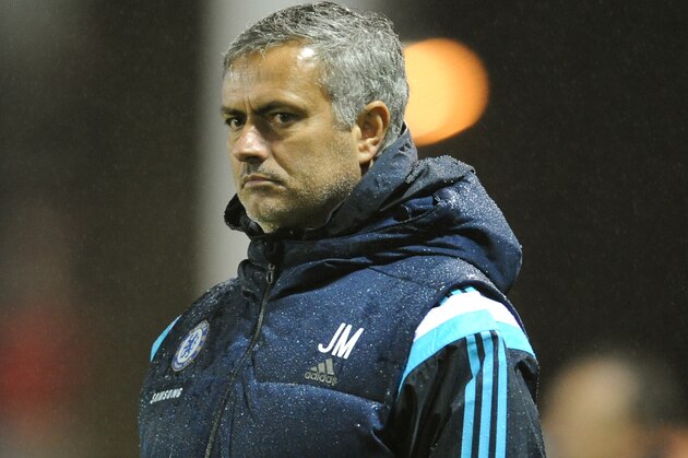 Chelsea manager Jose Mourinho watches hies team during the Fourth Round of the English League Cup soccer match between Shrewsbury Town and Chelsea at Greenhous Meadow, Shrewsbury, England, Tuesday, Oct. 28, 2014. (AP Photo/Rui Vieira)