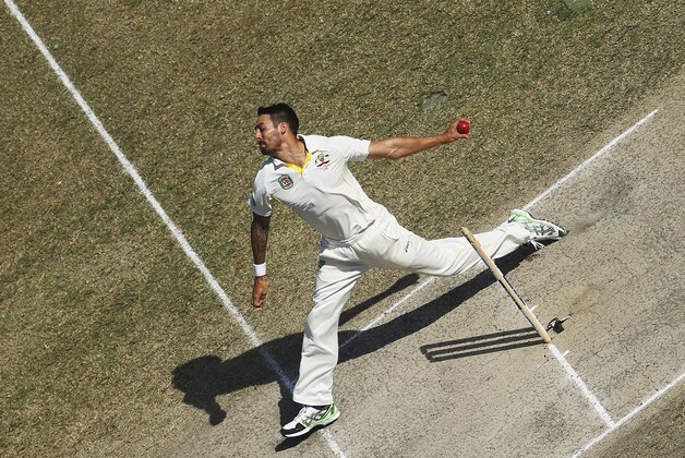 DUBAI, UNITED ARAB EMIRATES - OCTOBER 25:  Mitchell Johnson of Australia bowls during Day Four of the First Test between Pakistan and Australia at Dubai International Stadium on October 25, 2014 in Dubai, United Arab Emirates.  (Photo by Ryan Pierse/Getty Images)