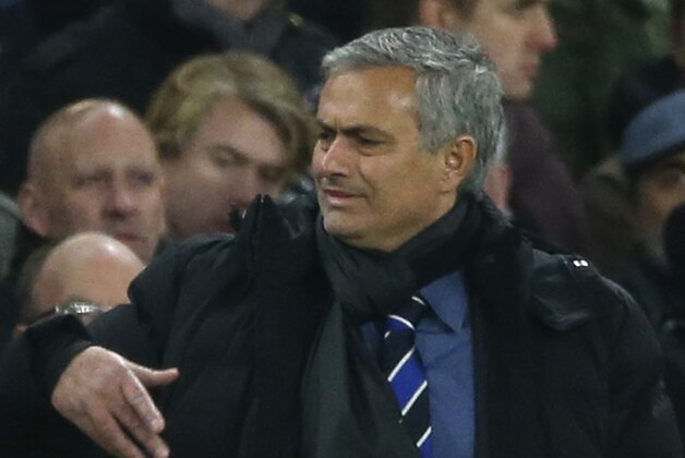 Chelsea's head coach Jose Mourinho gestures during the Group G Champions League match between Chelsea and Maribor at Stamford Bridge stadium in London, Britain, Tuesday, Oct. 21, 2014. (AP Photo/Alastair Grant)