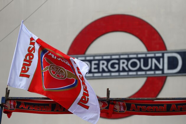 LONDON, ENGLAND - AUGUST 16:  An Arsenal flag flies on a street stall outside the underground prior to the Barclays Premier League match between Arsenal and Crystal Palace at Emirates Stadium on August 16, 2014 in London, England.  (Photo by Clive Mason/Getty Images)