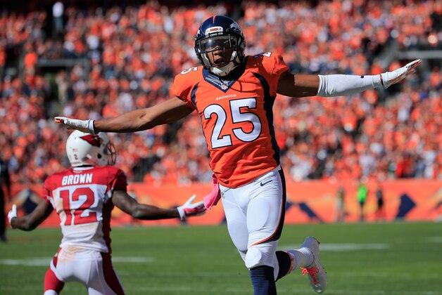 DENVER, CO - OCTOBER 05:  Cornerback Chris Harris #25 of the Denver Broncos celebrates after breaking up a pass intended for wide receiver John Brown #12 of the Arizona Cardinals at Sports Authority Field at Mile High on October 5, 2014 in Denver, Colorado. The Broncos defeated the Cardinals 41-20.  (Photo by Doug Pensinger/Getty Images)