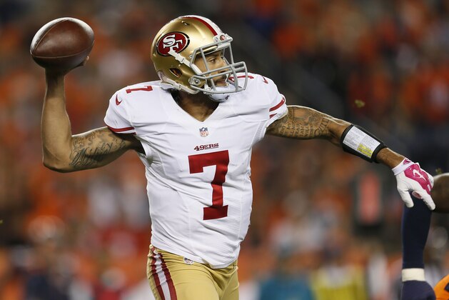 San Francisco 49ers quarterback Colin Kaepernick (7) looks to pass against the Denver Broncos during the first half of an NFL football game, Sunday, Oct. 19, 2014, in Denver.  (AP Photo/Joe Mahoney)