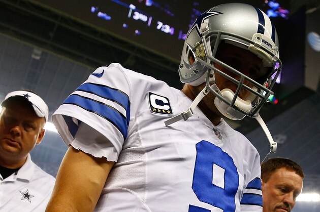 ARLINGTON, TX - OCTOBER 27:  Tony Romo #9 of the Dallas Cowboys leaves the field for the dressing room after being sacked by Keenan Robinson #52 of the Washington Redskins during the second half at AT&T Stadium on October 27, 2014 in Arlington, Texas.  (Photo by Tom Pennington/Getty Images)