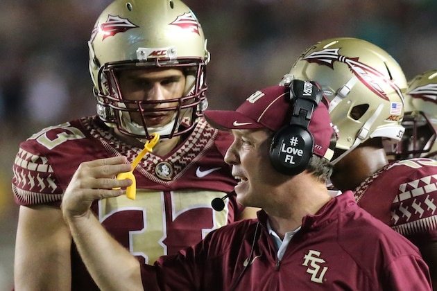 Florida State's coach, Jimbo Fisher calls his team to the sideline during a timeout in the third quarter against Notre Dame in an NCAA college football game, Saturday, Oct. 18, 2014, in Tallahassee, Fla. Florida State won 31-27. (AP Photo/Steve Cannon)