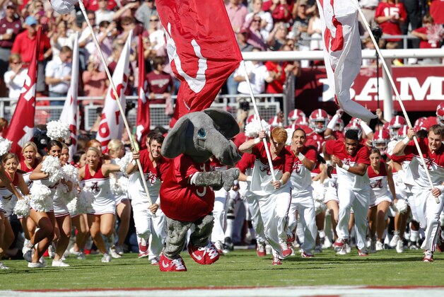 Oct 18, 2014; Tuscaloosa, AL, USA; Alabama Crimson Tide mascot Big Al brings his team onto the field prior to the game against the Texas A&M Aggies at Bryant-Denny Stadium. Mandatory Credit: Marvin Gentry-USA TODAY Sports