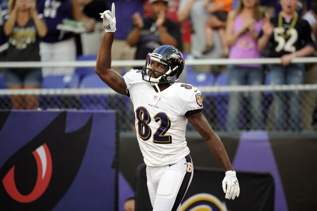 Baltimore Ravens wide receiver Torrey Smith runs onto the field after being introduced in the first half of an NFL preseason football game against the San Francisco 49ers, Thursday, Aug. 7, 2014, in Baltimore. (AP Photo/Nick Wass)