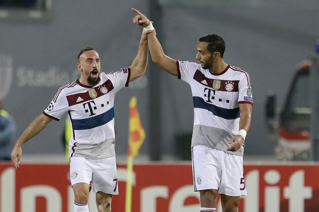 Bayern's Franck Ribery, left, and Bayern's Mehdi Benatia, right, celebrate a goal during the Group E Champions League soccer match between Roma and Bayern Munich at the Olympic stadium, in Rome, Tuesday, Oct. 21, 2014. (AP Photo/Andrew Medichini)