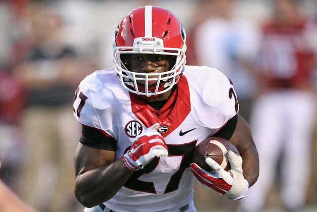 Oct 18, 2014; Little Rock, AR, USA; Georgia Bulldogs tailback Nick Chubb (27) rushes against the Arkansas Razorbacks at War Memorial Stadium. Georgia defeated Arkansas 45-32. Mandatory Credit: Nelson Chenault-USA TODAY Sports