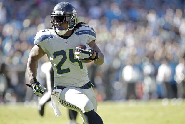 Seattle Seahawks' Marshawn Lynch (24) runs the football against the Carolina Panthers during the second half of an NFL football game Sunday, Oct. 26, 2014, in Charlotte, N.C. The Seahawks won 13-9. (AP Photo/Bob Leverone)