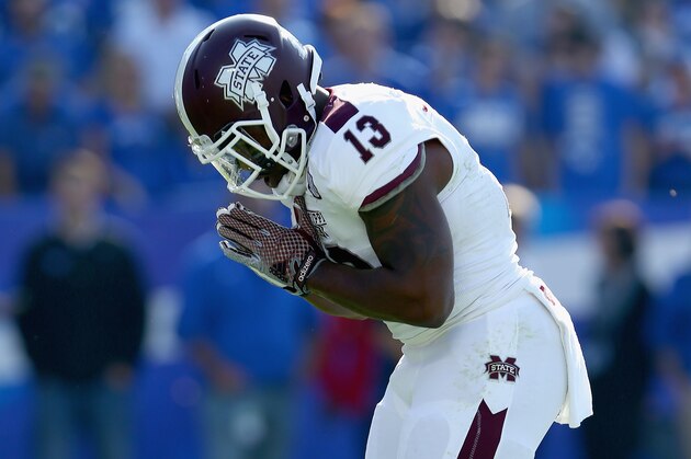 LEXINGTON, KY - OCTOBER 25:  Josh Robinson #13 of the Mississippi State Bulldogs celebrates after running for a touchdown during the game against the Kentucky Wildcats at Commonwealth Stadium on October 25, 2014 in Lexington, Kentucky.  (Photo by Andy Lyons/Getty Images)