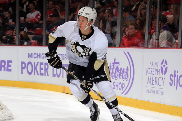 DETROIT, MI - OCTOBER 23: Olli Maatta #3 of the Pittsburgh Penguins turns up ice with the puck against the Detroit Red Wings during a NHL game on October 23, 2014 at Joe Louis Arena in Detroit, Michigan. The Wings defeated the Penguins 3-2 in overtime. (Dave Reginek/NHLI via Getty Images)