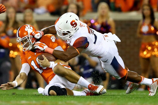 CLEMSON, SC - OCTOBER 25:  Cameron Lynch #38 of the Syracuse Orange hits Cole Stoudt #18 of the Clemson Tigers during their game at Memorial Stadium on October 25, 2014 in Clemson, South Carolina.  (Photo by Streeter Lecka/Getty Images)