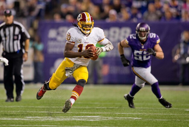 Nov 7, 2013; Minneapolis, MN, USA; Washington Redskins quarterback Robert Griffin III (10) scrambles against the Minnesota Vikings in the second quarter at Mall of America Field at H.H.H. Metrodome. The Vikings win 34-27. Mandatory Credit: Bruce Kluckhohn-USA TODAY Sports