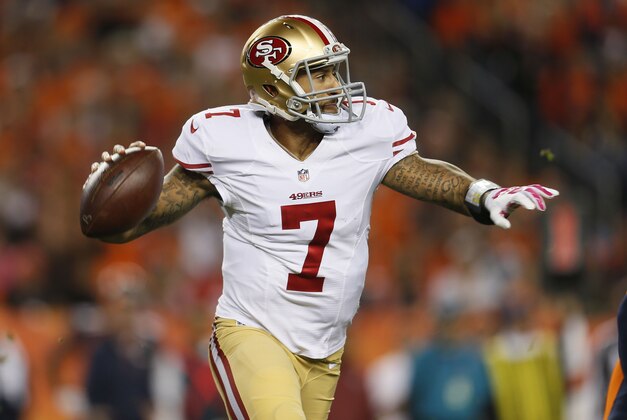 San Francisco 49ers quarterback Colin Kaepernick (7) looks to pass against the Denver Broncos during the first half of an NFL football game, Sunday, Oct. 19, 2014, in Denver.  (AP Photo/Joe Mahoney)