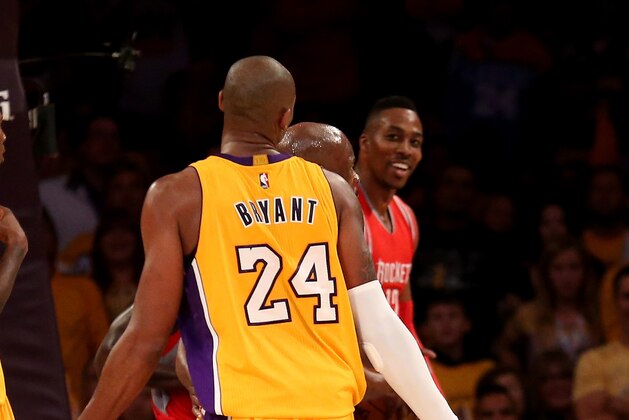 LOS ANGELES, CA - OCTOBER 28:  Kobe Bryant #24 of the Los Angeles Lakers and Dwight Howard #12 of the Houston Rockets exchange words during a secong half incident that resulted in a technical foul against each player, a personal foul against Bryant, and a flagrant foul against Howard at Staples Center on October 28, 2014 in Los Angeles, California.  The Rockets won 108-90. NOTE TO USER: User expressly acknowledges and agrees that, by downloading and or using this photograph, User is consenting to the terms and conditions of the Getty Images License Agreement.  (Photo by Stephen Dunn/Getty Images)