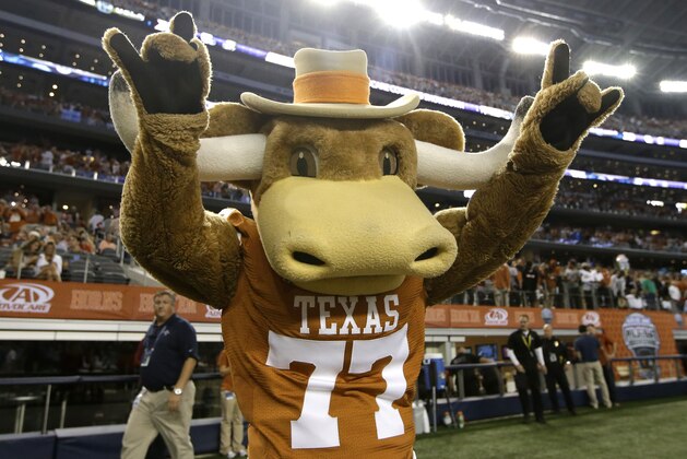 The Texas Longhorns mascot performs during an NCAA college football game against UCLA, Saturday, Sept. 13, 2014, in Arlington, Texas. (AP Photo/Tony Gutierrez)
