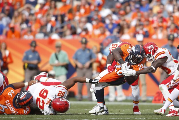 Sep 14, 2014; Denver, CO, USA; Denver Broncos running back Montee Ball (28) runs with the ball during the second half against the Kansas City Chiefs at Sports Authority Field at Mile High. The Broncos won 24-17. Mandatory Credit: Chris Humphreys-USA TODAY Sports