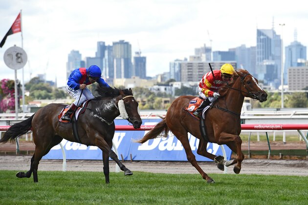 MELBOURNE, AUSTRALIA - MARCH 08: Stephen Baster riding Clifton Red defeats Vlad Duric riding Ygritte in Race 1 TBV Thoroughbred Breeders Stakes during Australian Cup Day at Flemington Racecourse on March 8, 2014 in Melbourne, Australia.  (Photo by Vince Caligiuri/Getty Images)