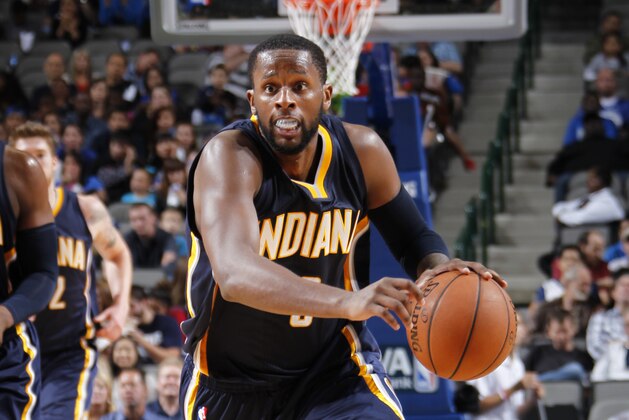 DALLAS, TX - OCTOBER 12: C.J. Miles #0 of the Indiana Pacers handles the ball against the Dallas Mavericks on October 12, 2014 at the American Airlines Center in Dallas, Texas. NOTE TO USER: User expressly acknowledges and agrees that, by downloading and or using this photograph, User is consenting to the terms and conditions of the Getty Images License Agreement. Mandatory Copyright Notice: Copyright 2014 NBAE (Photo by Glenn James/NBAE via Getty Images)