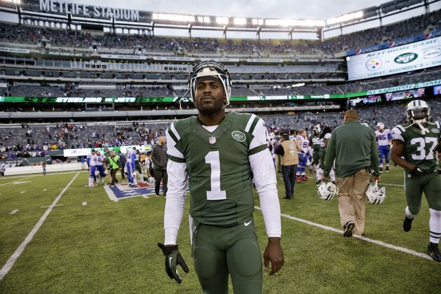 New York Jets quarterback Michael Vick (1) walks off the field after an NFL football game against the Buffalo Bills Sunday, Oct. 26, 2014, in East Rutherford, N.J. The Bills won the game 43-23. (AP Photo/Seth Wenig)