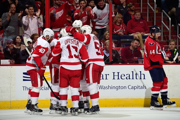 WASHINGTON, DC - OCTOBER 29:  Justin Abdelkader #8 of the Detroit Red Wings celebrates with his teammates after scoring a goal in the third period during an NHL Game against the Washington Capitals at Verizon Center on October 29, 2014 in Washington, DC.  (Photo by Patrick McDermott/NHLI via Getty Images)