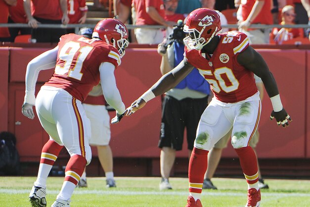 Oct 26, 2014; Kansas City, MO, USA; Kansas City Chiefs outside linebacker Justin Houston (50) celebrates with linebacker Tamba Hali (91) after making a sack against the St. Louis Rams in the first half at Arrowhead Stadium. Mandatory Credit: John Rieger-USA TODAY Sports