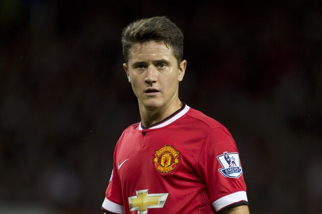 Manchester United's Ander Herrera waits for a corner during his team's pre season friendly soccer match against Valencia at Old Trafford Stadium, Manchester, England, Tuesday Aug. 12, 2014. (AP Photo/Jon Super)