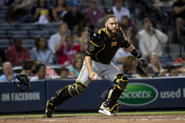 Pittsburgh Pirates catcher Russell Martin (55) prepares to throw out Atlanta Braves' Aaron Harang after a dropped third strike in the fourth inning of a baseball game Monday, Sept. 22, 2014, in Atlanta. (AP Photo/John Bazemore) Pittsburgh Pirates catcher Russell Martin (55) prepares to throw out Atlanta Braves' Aaron Harang after a dropped third strike in the fourth inning of a baseball game Monday, Sept. 22, 2014, in Atlanta. (AP Photo/John Bazemore)