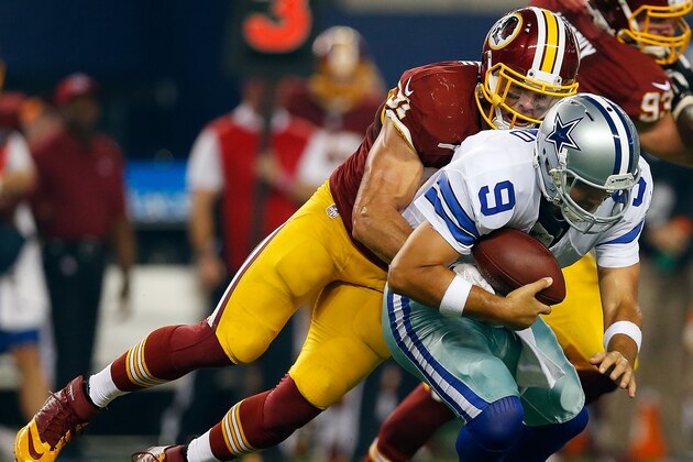 ARLINGTON, TX - OCTOBER 27:  Ryan Kerrigan #91 of the Washington Redskins sacks Tony Romo #9 of the Dallas Cowboys during the first half at AT&T Stadium on October 27, 2014 in Arlington, Texas.  (Photo by Tom Pennington/Getty Images)