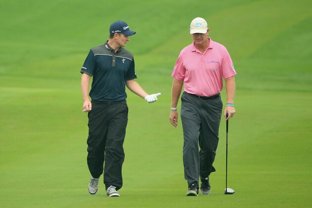 SHANGHAI, CHINA - OCTOBER 30:  Justin Rose of England (left) walks with Ernie Els of South Africa on the tenth hole during the first round of the BMW Masters at Lake Malaren Golf Club on October 30, 2014 in Shanghai, China.  (Photo by Andrew Redington/Getty Images)