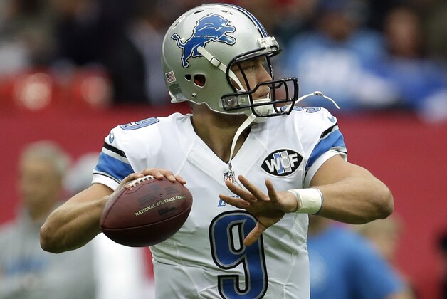 Detroit Lions quarterback Matthew Stafford (9) warms up before the NFL football game against the Atlanta Falcons at Wembley Stadium, London, Sunday, Oct. 26, 2014.  (AP Photo/Matt Dunham)
