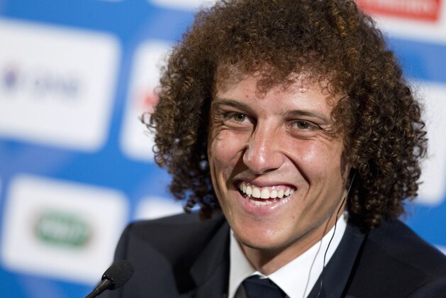 Brazil's David Luiz smiles during a press conference, in Paris, Thursday, Aug. 7, 2014. Defender Luiz believes the only way to get over his World Cup disappointment is to be back on the pitch as quickly as possible. French champion Paris Saint-Germain signed Luiz on a five-year deal that was announced before his lackluster performances in Brazil's last two games at the World Cup last month. (AP Photo/Jacques Brinon)