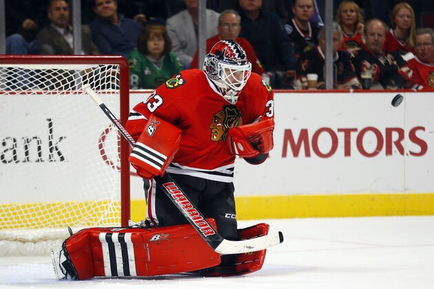 Chicago Blackhawks goalie Scott Darling (33) stops a shot by the Anaheim Ducks during the second period of an NHL hockey game Tuesday, Oct. 28, 2014, in Chicago. (AP Photo/Jeff Haynes)