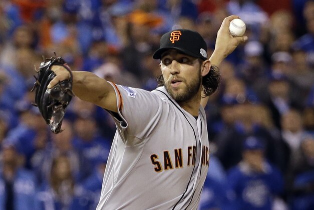 San Francisco Giants pitcher Madison Bumgarner throws during the fifth inning of Game 7 of baseball's World Series against the Kansas City Royals Wednesday, Oct. 29, 2014, in Kansas City, Mo. (AP Photo/David J. Phillip)