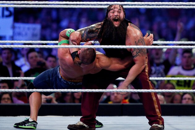 John Cena, left, and Bray Wyatt, right, compete during Wrestlemania XXX at the Mercedes-Benz Super Dome in New Orleans on Sunday, April 6, 2014. (Jonathan Bachman/AP Images for WWE)