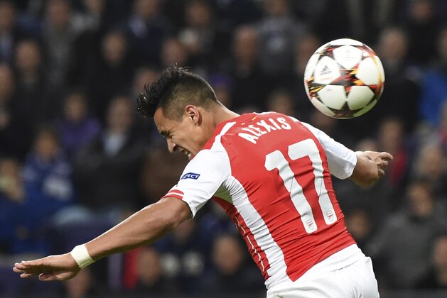 Arsenal's Alexis Sanchez tries to score with his back as he fails to head the ball in the penalty box during the Group D Champions League match between Anderlecht and Arsenal at Constant Vanden Stock Stadium in Brussels, Belgium, Wednesday Oct. 22, 2014. (AP Photo/Geert Vanden Wijngaert)